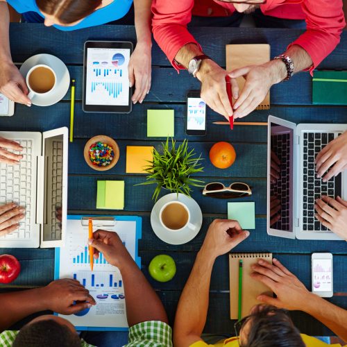 High angle view of people working together at one table